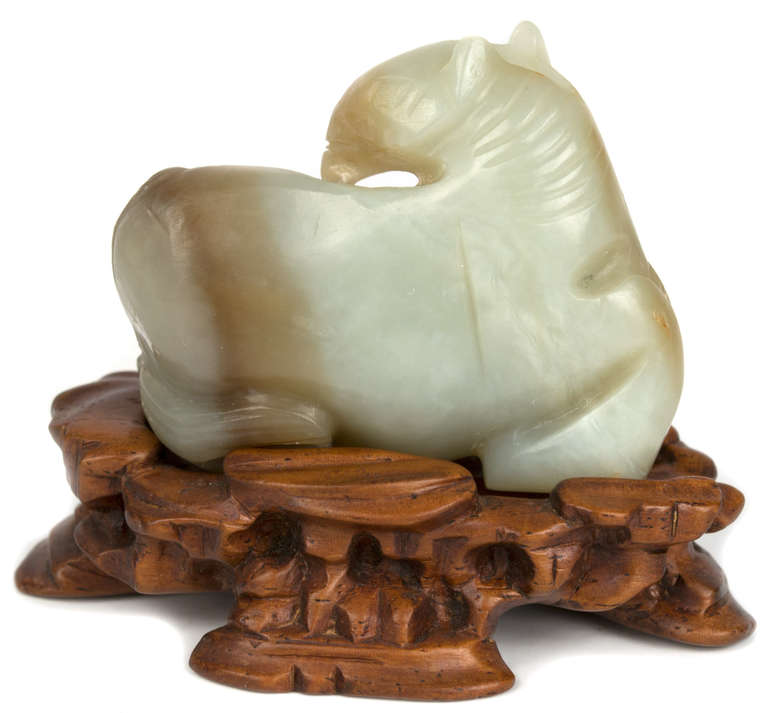Chinese Celadon and Russet Jade Horse on Wood Stand
