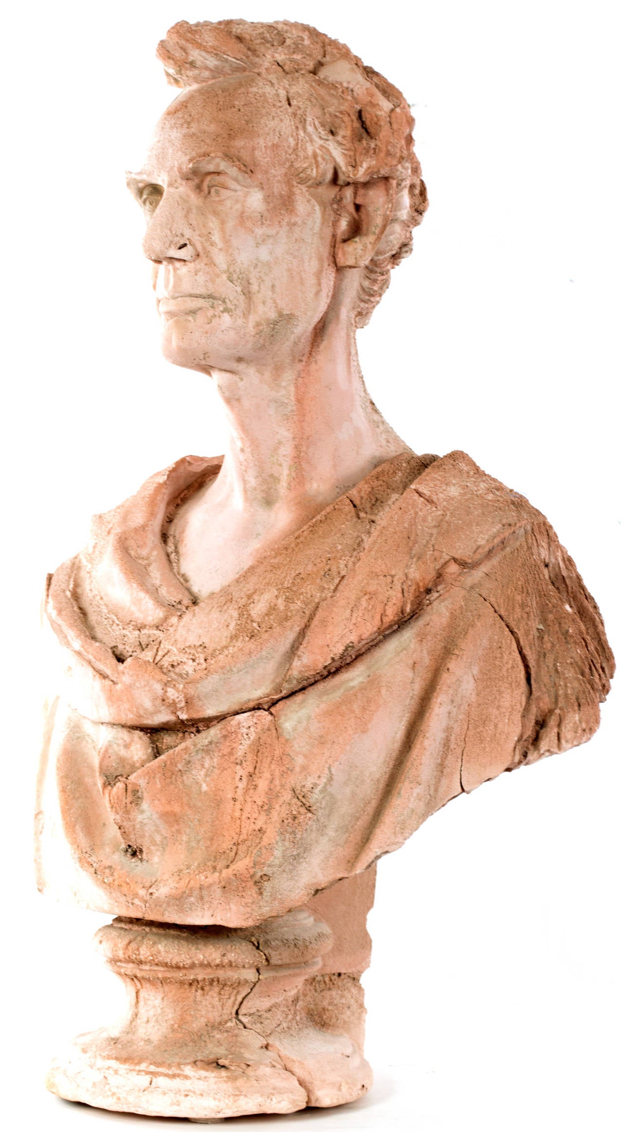 A terra-cotta bust of President Abraham Lincoln in the style of a Greco-Roman dress and attitude. Beautifully sculpted by an artist able to combine a very sensitive portrait of Lincoln, the work is made to look deliberately distressed on the