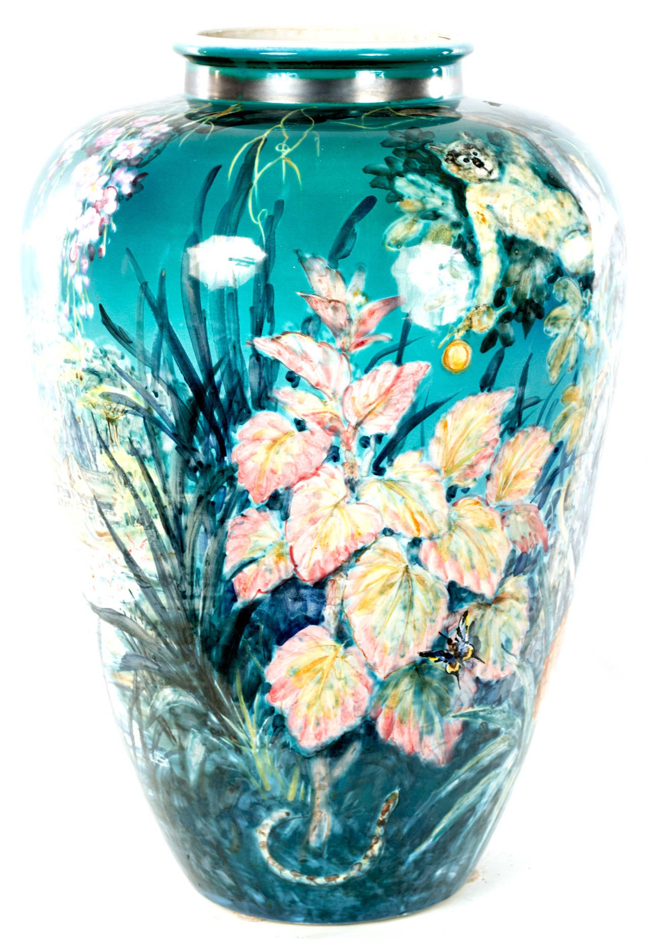 Featuring a painted tropical (i.e. South Pacific) scene with exotic fruits, animals, ocean, and huts. The baluster vase was made by the German company Ulmer Keramik, which was established in Bohemia after World War II. The firm was known for a
