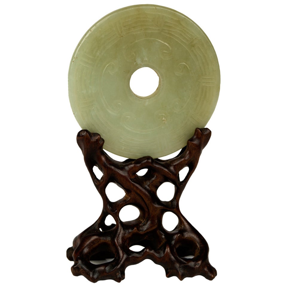 Carved and Pierced Celadon Jade Disc on Stand