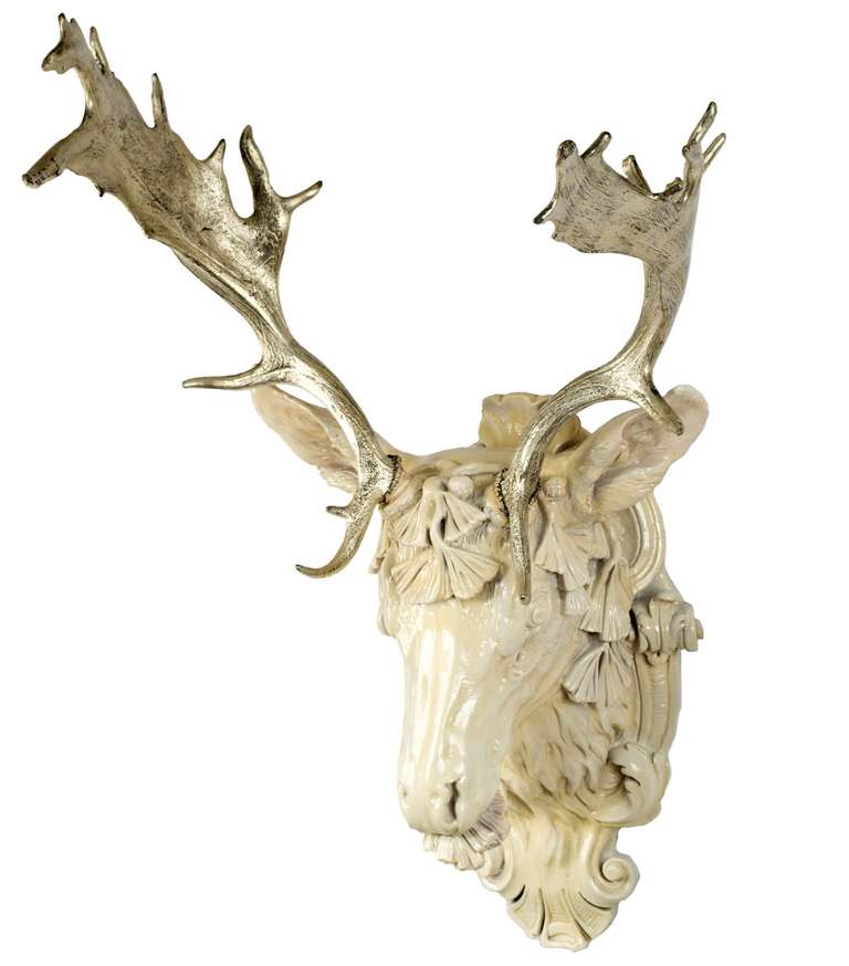 The nineteenth-century antlers from a fallow deer have been gilt with white, 18-karat-gold leaf and mounted on white, gessoed head of mount, taken from a nineteenth-century French mold.