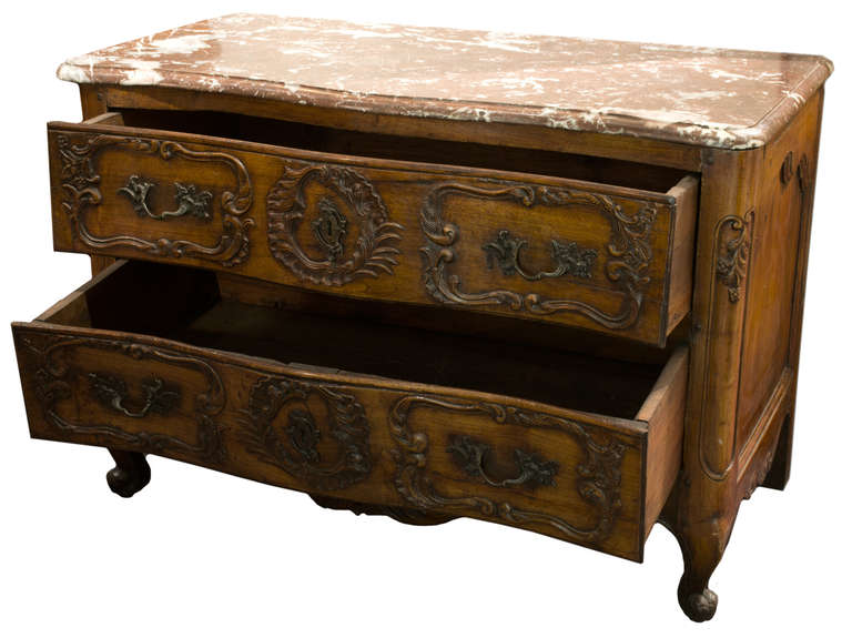 Country An eighteenth-century French Provençal carved commode