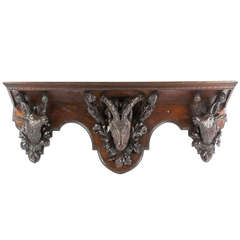 A 19th Century Black Forest Wall Shelf in Carved Linden Wood