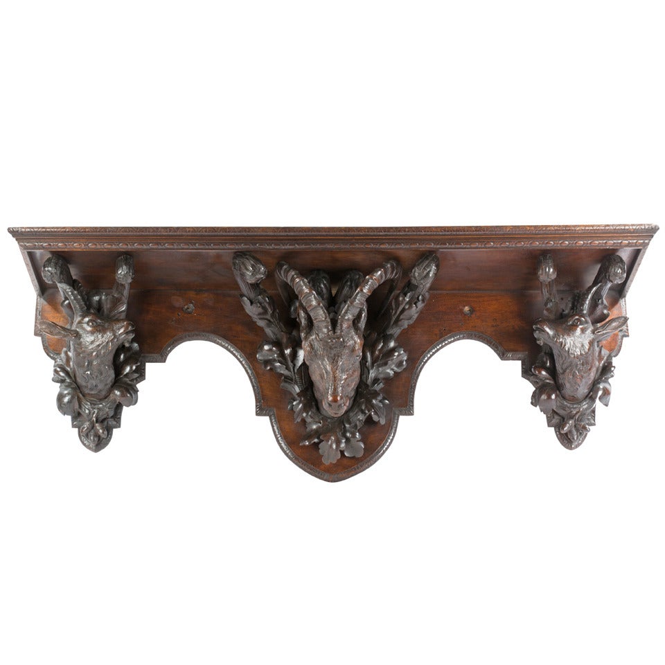 A 19th Century Black Forest Wall Shelf in Carved Linden Wood