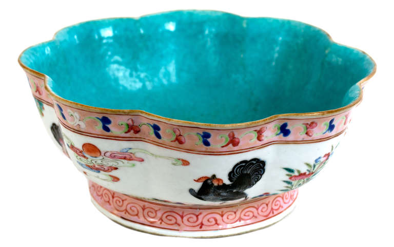 With a lobed rim and turquoise ground interior, the outside of the brush pot is painted with thunder pattern borders and a frieze of roosters and the Three Friends of Winter. The base is signed with a Qinglong mark, dating the dish to the last