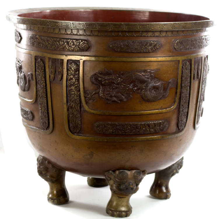 Used to hold incense sticks used in temple and ancestral rituals, this large, gilt bronze censer is based on ancient Chinese forms, unearthed during the Ming and Qing dynasties and replicated with fine materials in the eighteenth and nineteenth