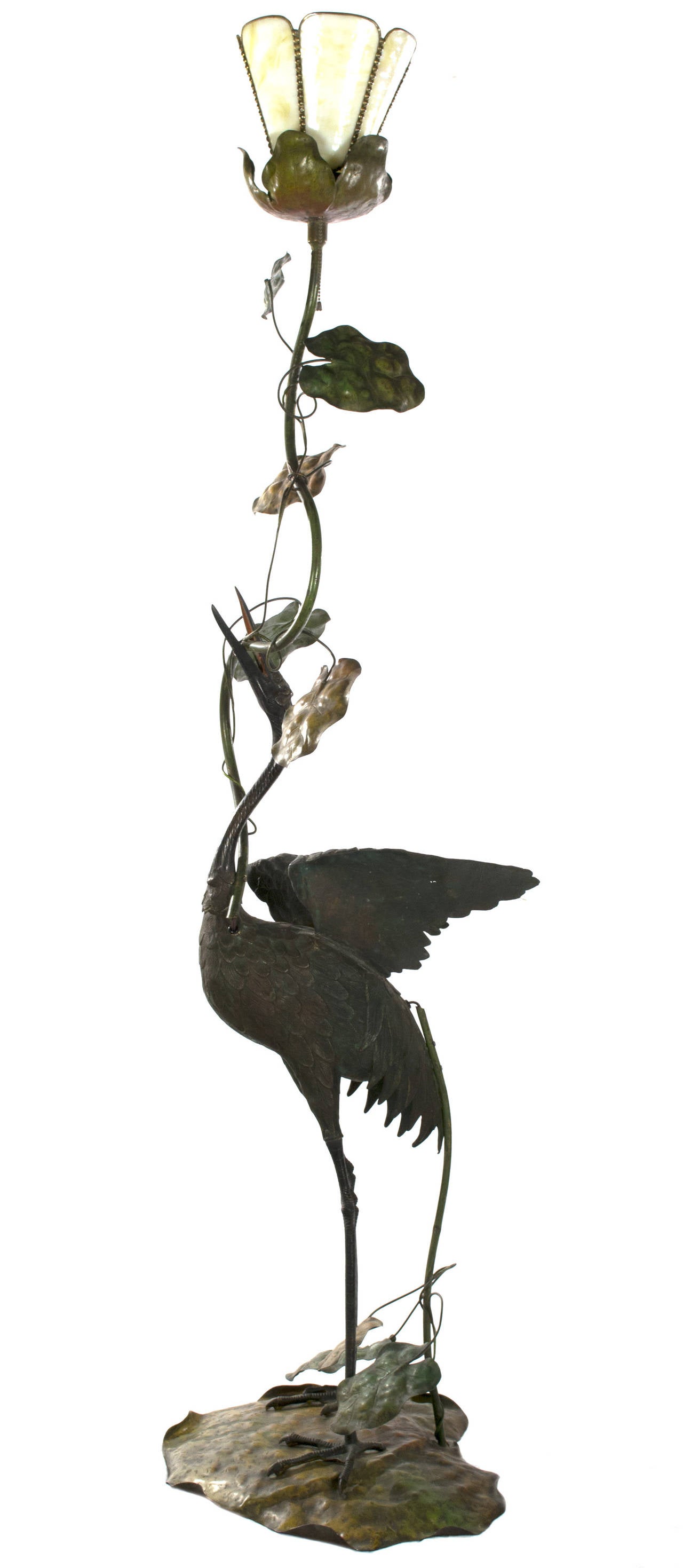 In the best tradition of Japanese depictions of nature in art, this large floor lamp depicts a heron as it gingerly stretches its wings and raises its head to the light. The sculpture, a work of beautiful observations and artistry, the heron and