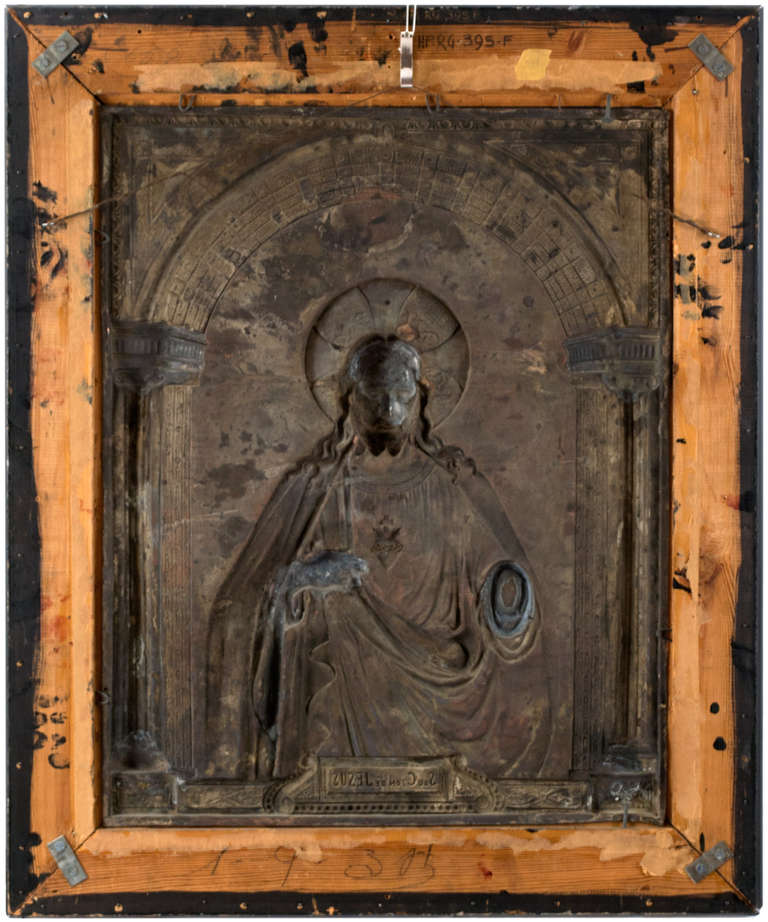 An Italian, silver-over-copper, low-relief sculpture of Most Sacred Heart of Jesus, a representation of Jesus Christ's physical heart as a sign of his Divine love. The large work dates to the first half of the 20th century and is housed in an