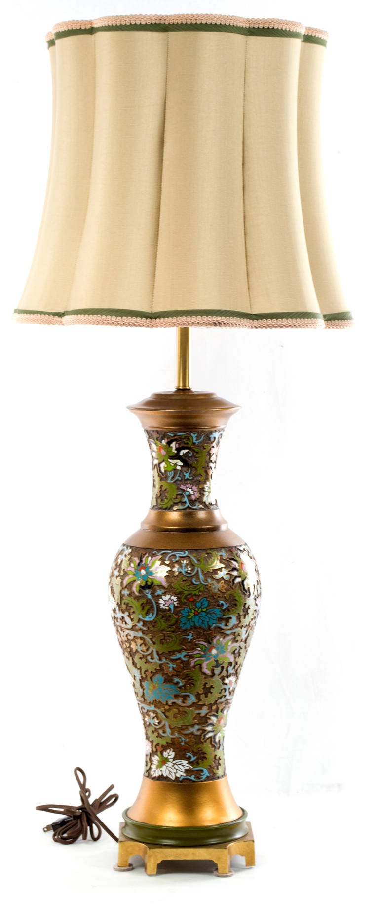 A gilt bronze cloisonné lamp topped with an embroidered silk shade, made in China during the middle of 20th century.