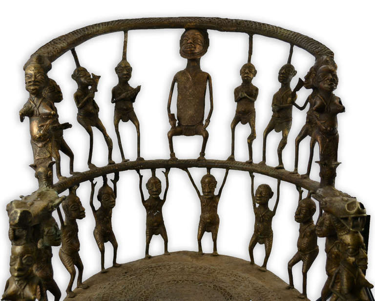 This decorative bronze chair consists of 33 full-figure sculptures.  It is made in a style that consciously references pieces from Benin, Cameroon, and other African cultures.  