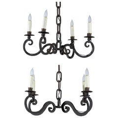 Vintage Pair of 1940s French Black Iron Four-Light Chandeliers with Scrolling Arms