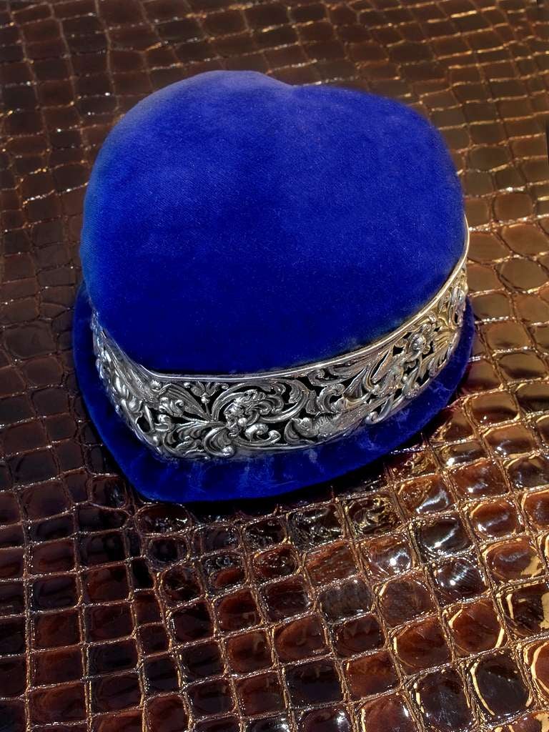 Royal blue velvet heart shaped jewellery box with an intricately detailed sterling silver band.