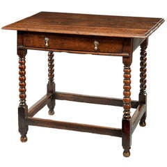A 17th Century oak table. 3
