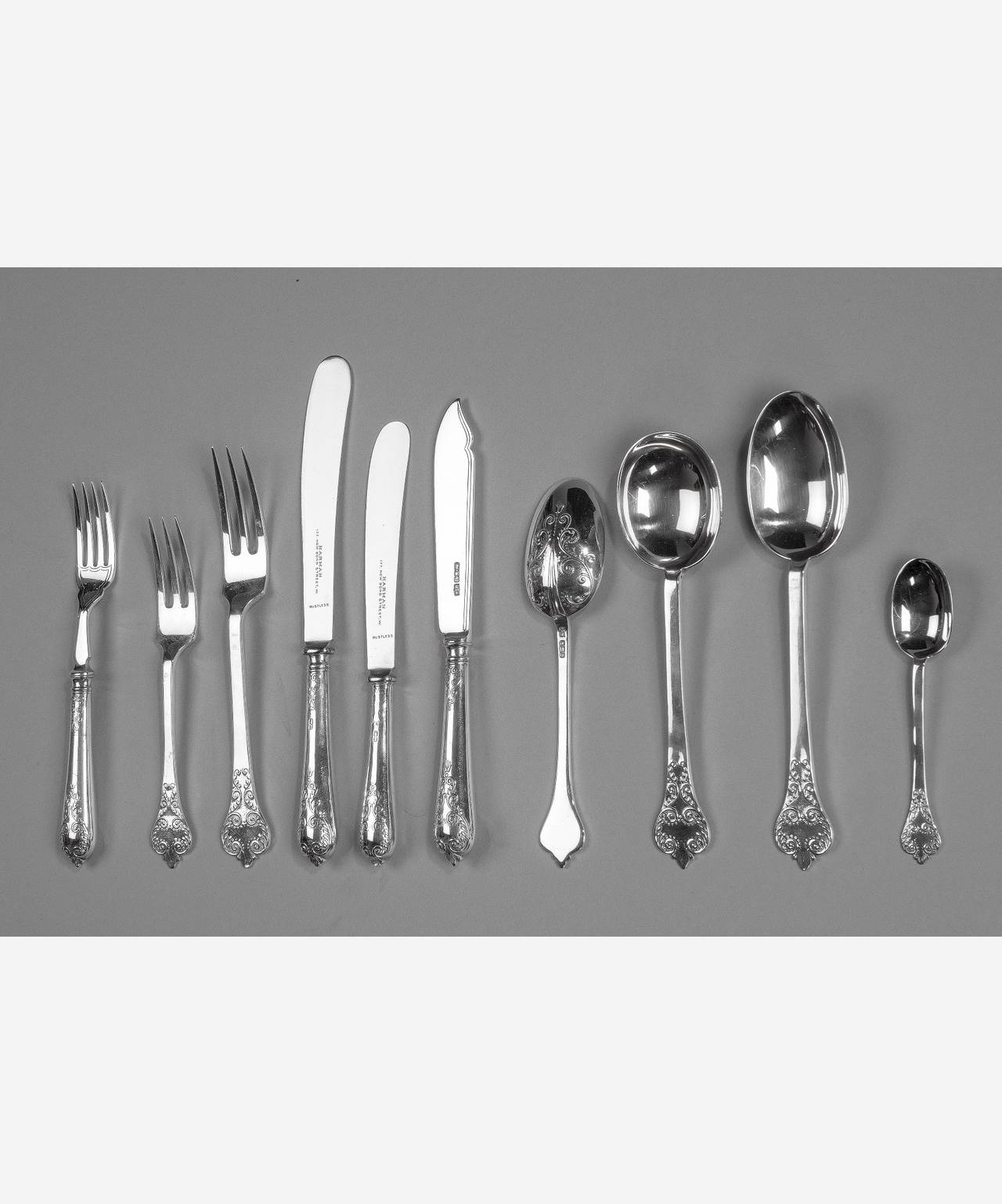 An extensive sterling silver canteen of cutlery in the trephid lace back pattern by Mappin and Webb. Hallmarked Sheffield, 1917.

12 place settings including original knives.

Settings for soup, fish, starter, main course, dessert and tea