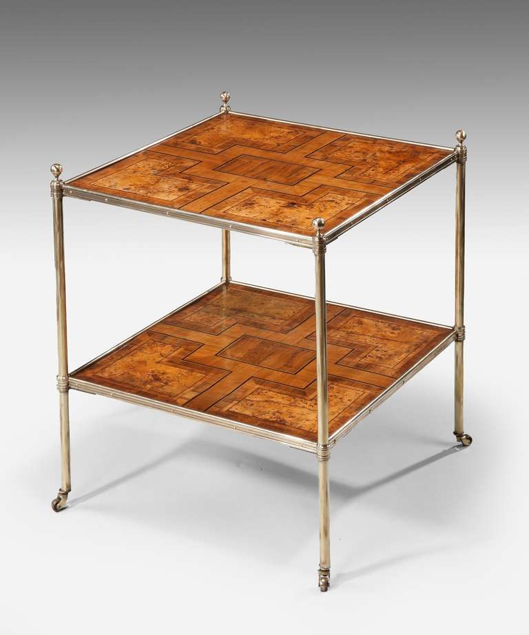 An unusual late 19th Century parquetry veneered etager veneered in burr walnut, tulipwood and rosewood; raised on turned brass legs.