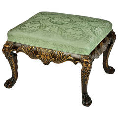 A George I style walnut stool.