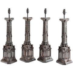 A Set Of Four Gothic Bronze Table Lamps.