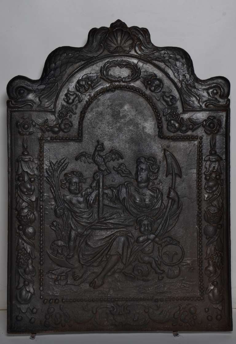 A 17th century fireback in perfect condition, displaying the saint of hope (Spes) in the ancient Roman religion.
This is on of the 3 Theological virtues: Faith, Hope, and Charity.

Height: 35.82 inch or 91 cm
Width:  25.78 inc or 65.5 cm
Thickness: