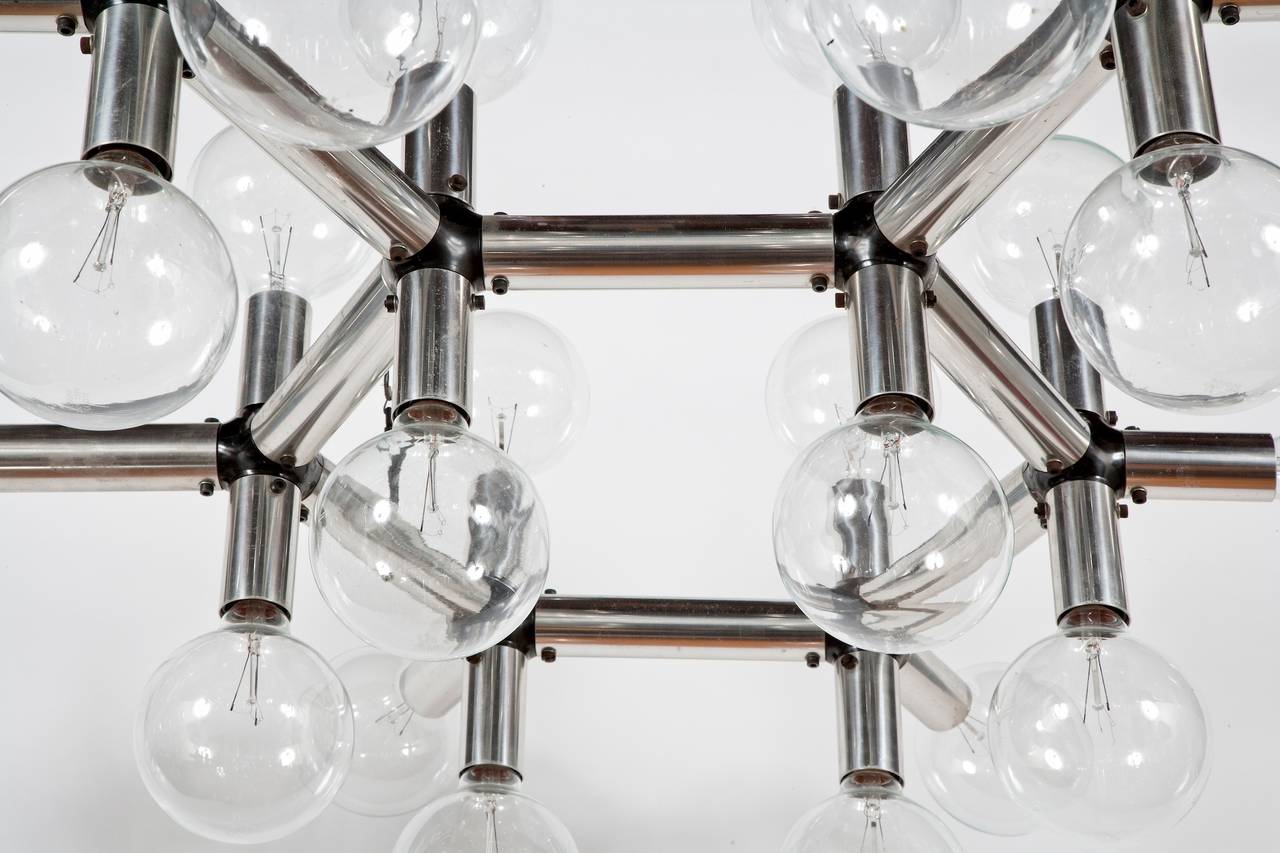 Suspension lights designed by Robert Haussmann for Swiss Lamps International.
Aluminium molecular hexagonal elements with 56 light bulbs, large, medium or ordinary light bulbs.

Adjustable height.