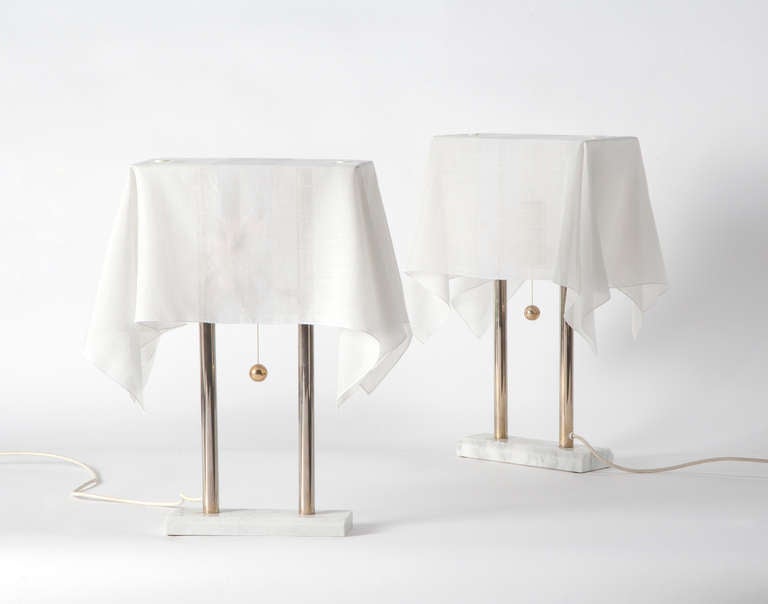 Pair of table lamps by Kazuhide Takahama produced by Sirrah.
Carrara marble base, metal structure with 24-karats gold plated elements, cotton lampshades.