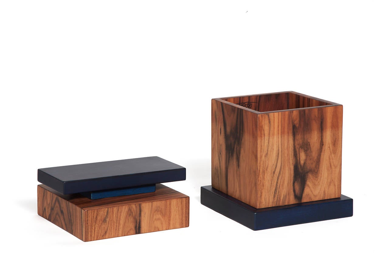 Plywood box of the series 'Scatole Segrete' ( Secret Boxes).
Birch plywood structure covered with three layers of rose-wood.
Knob and base in lime wood coloured with blue aniline.
Produced in a limited edition of 99