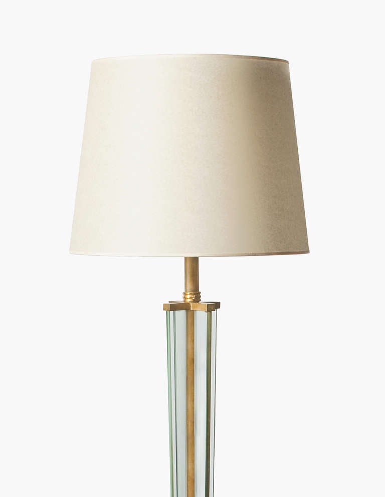 Floor lamp with a parchment  paper shade | brass stem | glass base and vertical inserts, some minor wear at the base.