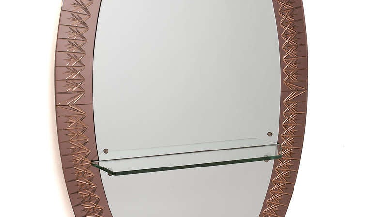 Large oval mirror /console with pink etched mirrored glass frame and a clear glass console shelf | Brass surround edges and legs