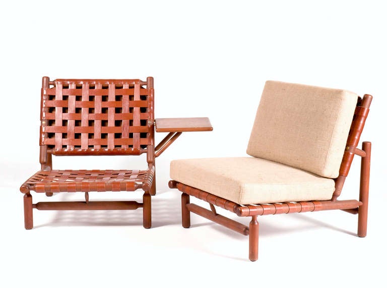 Pair of armchairs: woven leather straps, wooden structure . Side table attached to one of them | chairs can be used with or without cushions. 

Produced by Esposizione Permanente Mobili Cantu'
Literature: catalogue of 