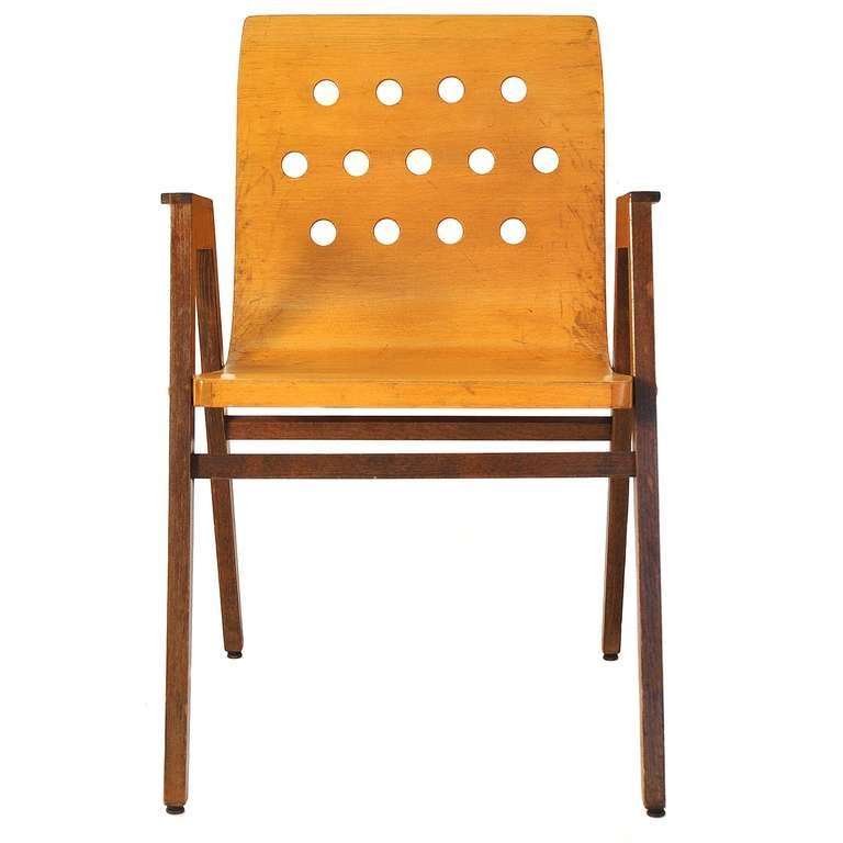 This chair was designed by Roland Rainer in 1951 for the Viennese Citc Hall. 
Manufactored by Emil  Alfred Pollak.
This model differs from the typical ones by the colours - usually the back and seat are dark stained, and the legs are bright. In