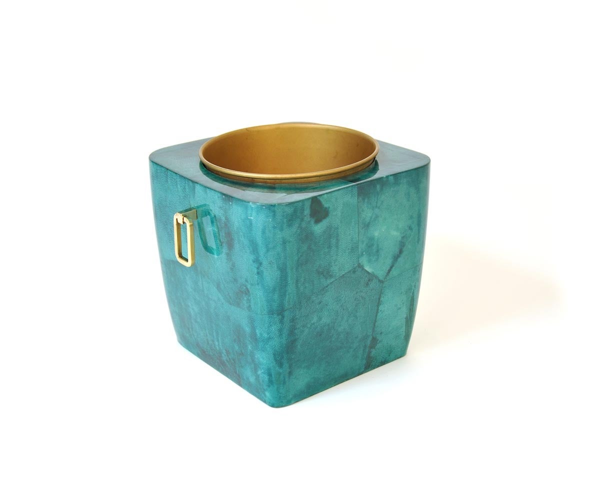 This Aldo Tura's champagne cooler is made out of goatskin with brass details.  The cooler inside is made out of anodised and lacquered sheet metal.