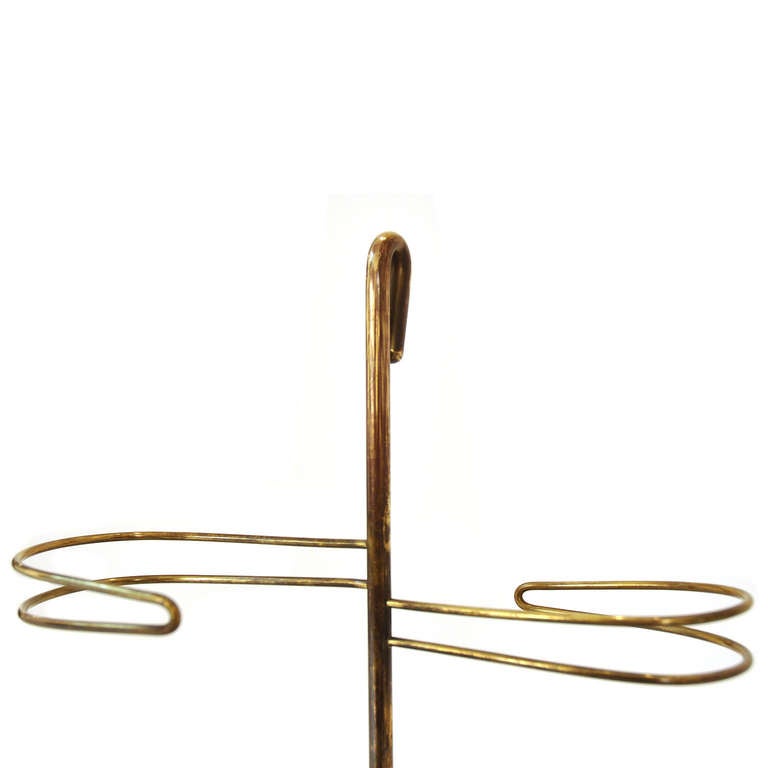 A beautiful umbrella stand designed and manufactured by Carl Aubock. A very unique and rare piece made out of brass and cast iron, with a signature on the stand.