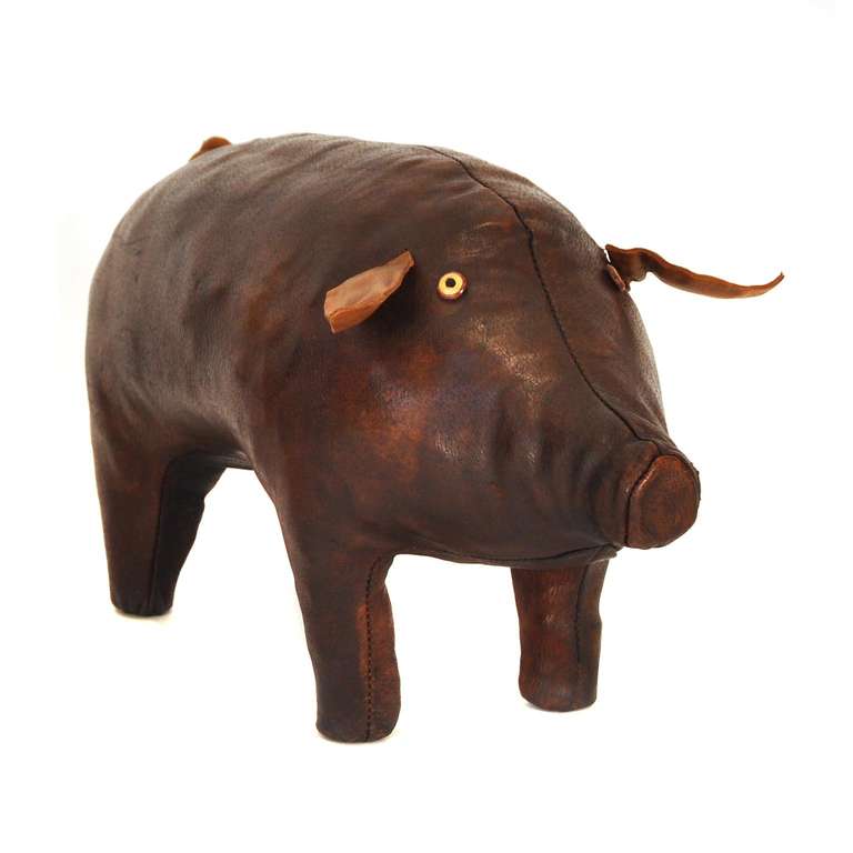 This pig stool is one of five animal stools designed by Dimitri Omersa in Great Britain around 1965. It is patinated and made out of hand-sewn reddish brown leather. The series of stools representing various animals was marketed by