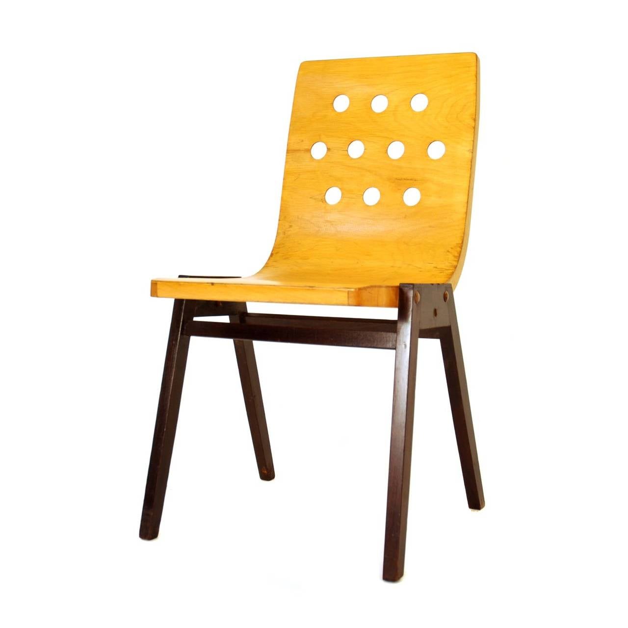 This chair was designed by Roland Rainer in 1951 for the Viennese City Hall.
Manufactured by Emil and Alfred Pollak.
This model differs from the typical ones by the colours - usually the back and the seat are dark stained, and the legs are bright.
