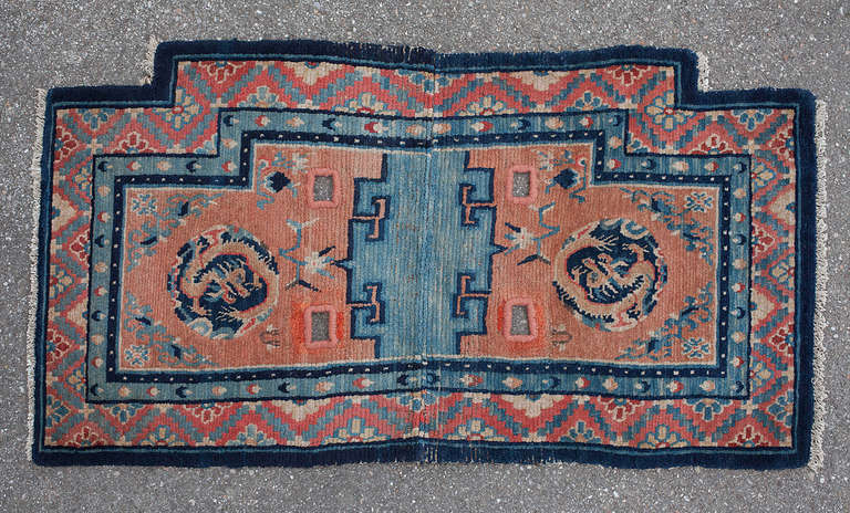 This exquisite saddle rug highlights the role of equestrian culture on the Tibetan plateau. 
Beautiful rugs were created to make the saddle more comfortable for horse and rider, decorate the horse and display the status of the owner. 
Tibetan