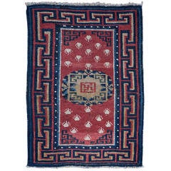 Charming Antique Tibetan Sitting Rug with Frog Foot Design