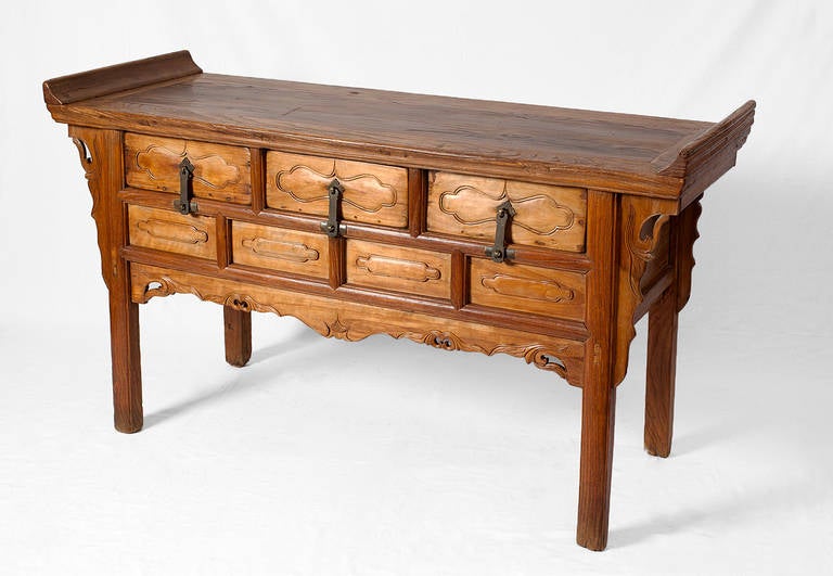 ***SUMMER SALE***
This 18th century three-drawer sideboard with everted flanges is a classic piece of vernacular Shanxi furniture. 

The top is made from beautifully grained and nicely patinated reddish-brown southern elm, with the everted flanges
