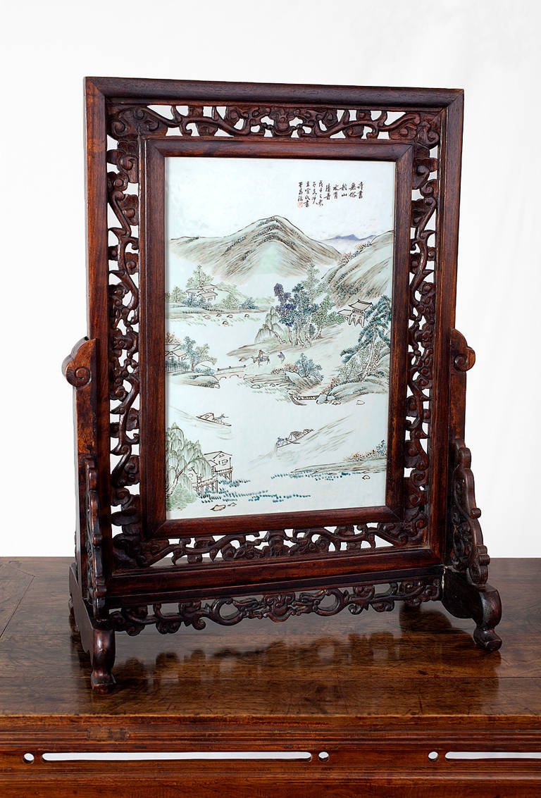 This elegant table screen opens the window into a traditional Chinese landscape. 

Screens were important pieces in Chinese households, sometimes beautifully decorated with paintings or stone panels. Smaller screens would be placed on tables for