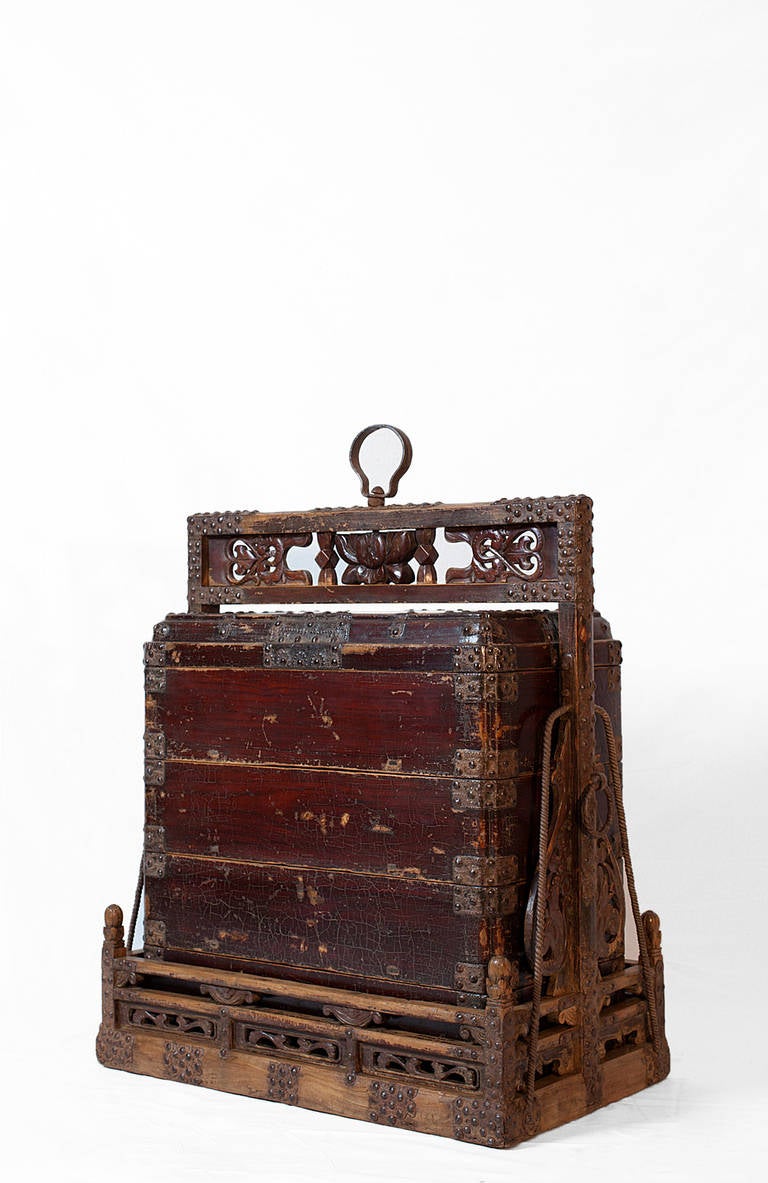This 17th century Shanxi province food chest is was originally designed for travelling, ceremonial outings or weddings. 
Large portable food boxes like this one were popular items during the Ming dynasty but very few pieces are as exquisitely