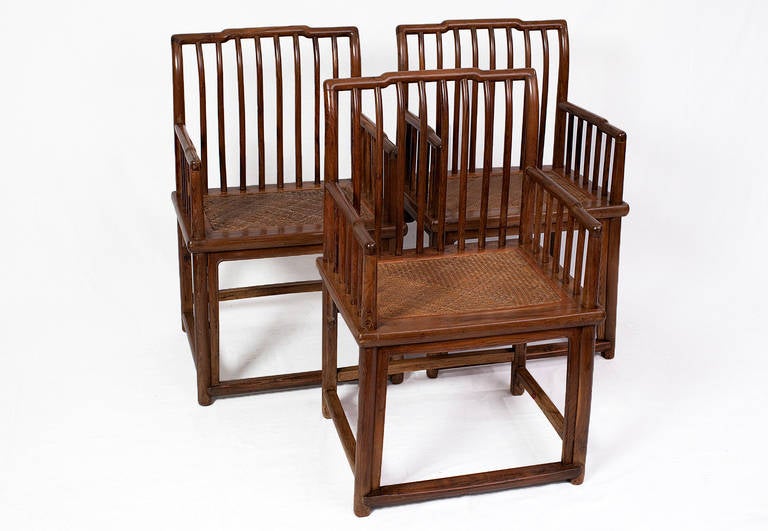 ***END OF SUMMER SALE***
These three elegant 18th century Shanxi spindle-back rose chairs are made from nicely grained elm wood with a soft honey hue. 

The chairs are constructed with a humpback top rail, which is supported by round posts that