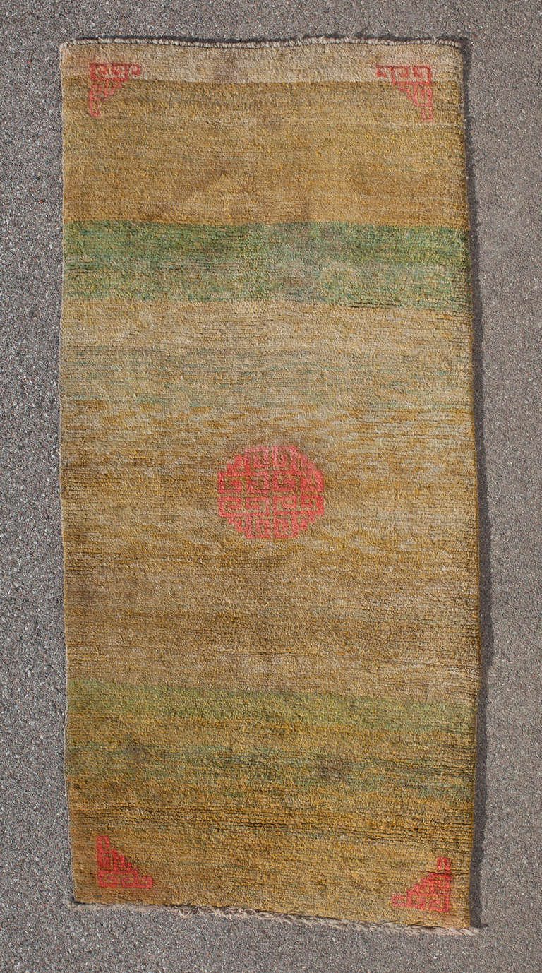 ***SUMMER SALE***
This Tibetan Khaden is a stunning example of early sitting and sleeping rugs from Central Tibet. Prior to the arrival of chemical dyes in the late 19th century, the colour range available to Tibetan weavers was limited but they