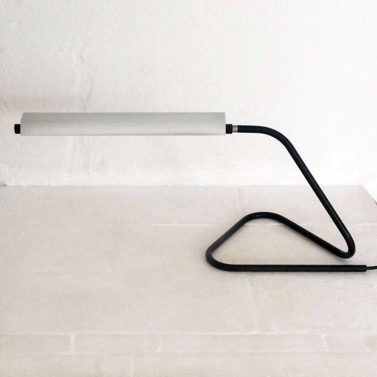 Radical and super minimalistic table lamp designed by Achille Castiglioni in 1949 when the first houdehold neon light was available .
It was also shown at the Triennale in 1951 . An original has not been seen since .

The lamp can also used as