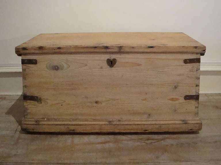 English 19th century simple pine trunk with various compartments inside - the traditional candle boxes and a small drawer. Slightly `shaped` sides and good dovetailing.  All original iron hinges and strapping - it has obviously been well made by an