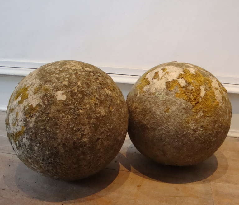 A pair of 19th century English carved stone balls with nice patination