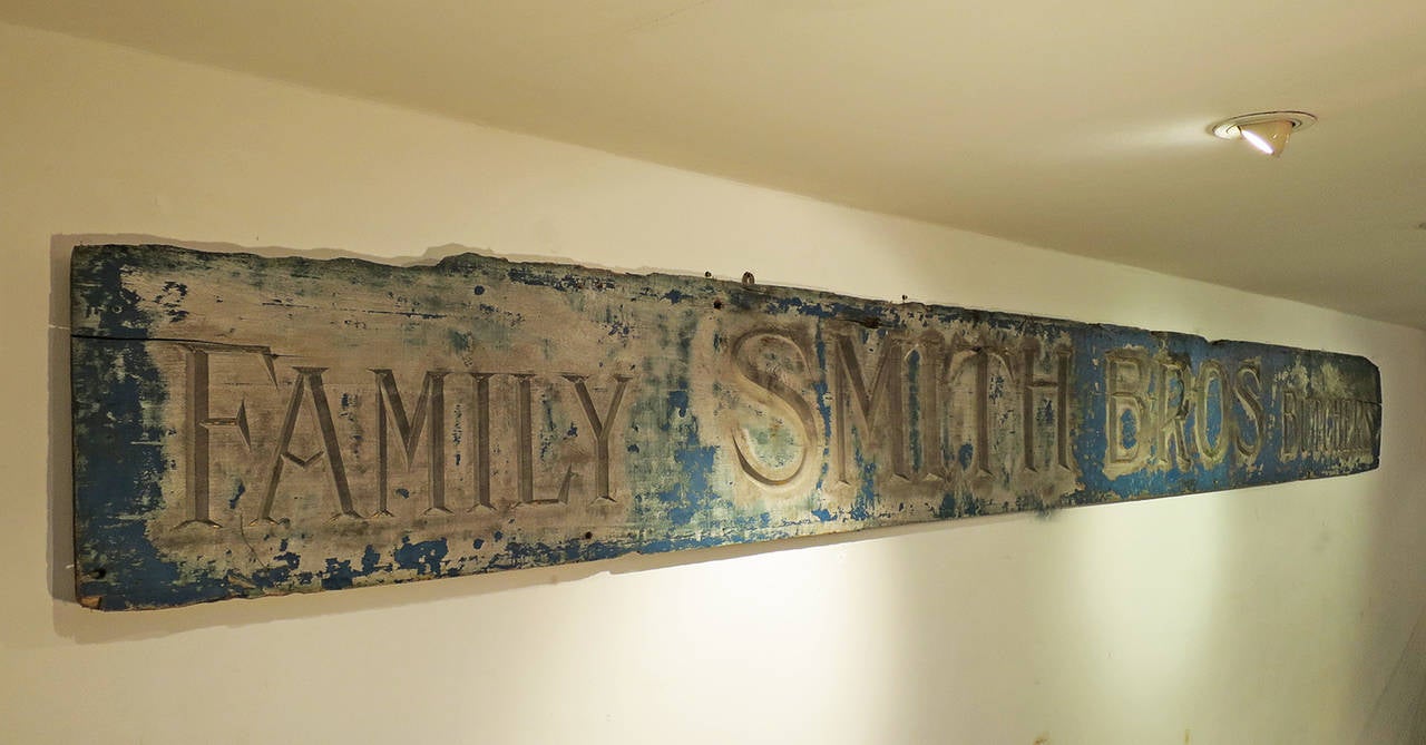19th century English carved butchers sign with remains of original blue paint and gilding, circa 1860.