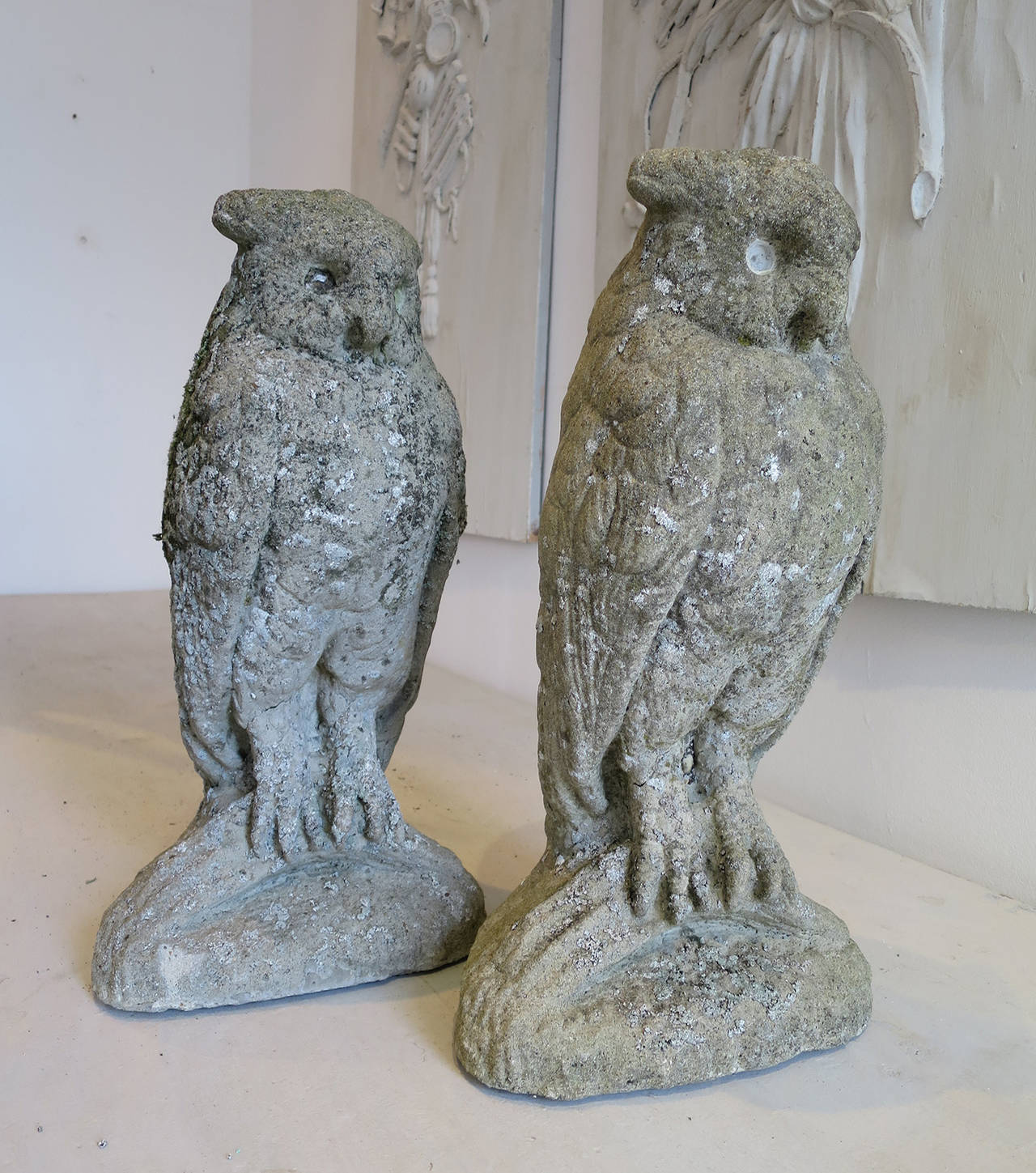 A pair of English composition stone owls, circa 1920 unusual to find a pair.