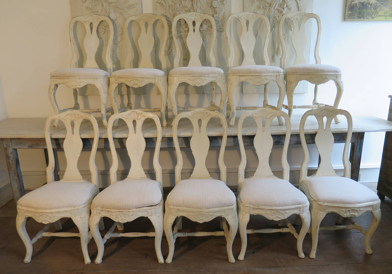 A superb set of ten Swedish 19th century Rococo chairs, circa 1880. The seats are covered in old French linen. This set of chairs was originally owned by a member of the Danish Royal Family, the Count of Rosenborg.