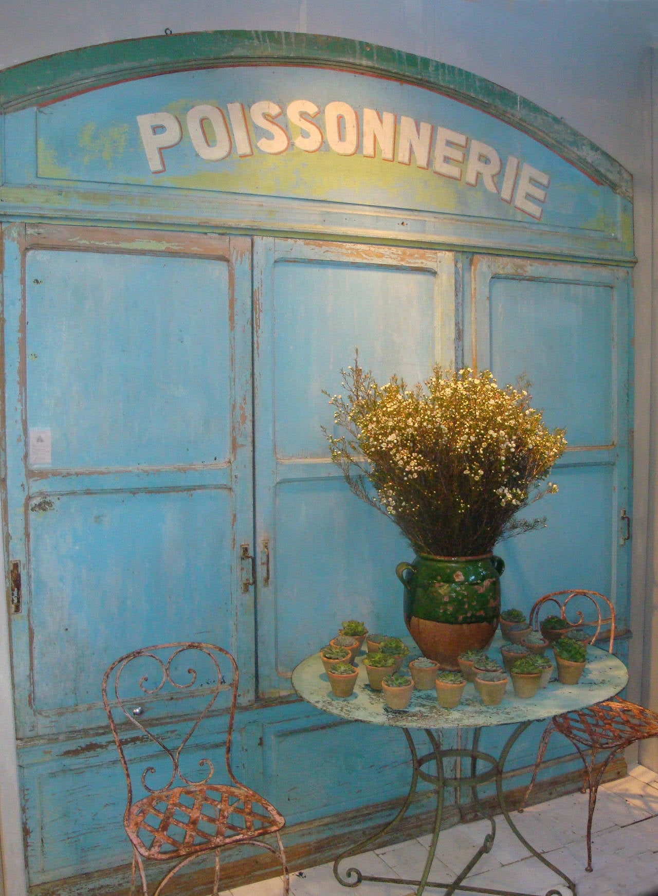 A very unusual French 19th century fish shop front with removable shutters, consisting of shop windows and front door - painted in delightful original colours. Could make a striking piece of decoration for a kitchen, cafe or.....?