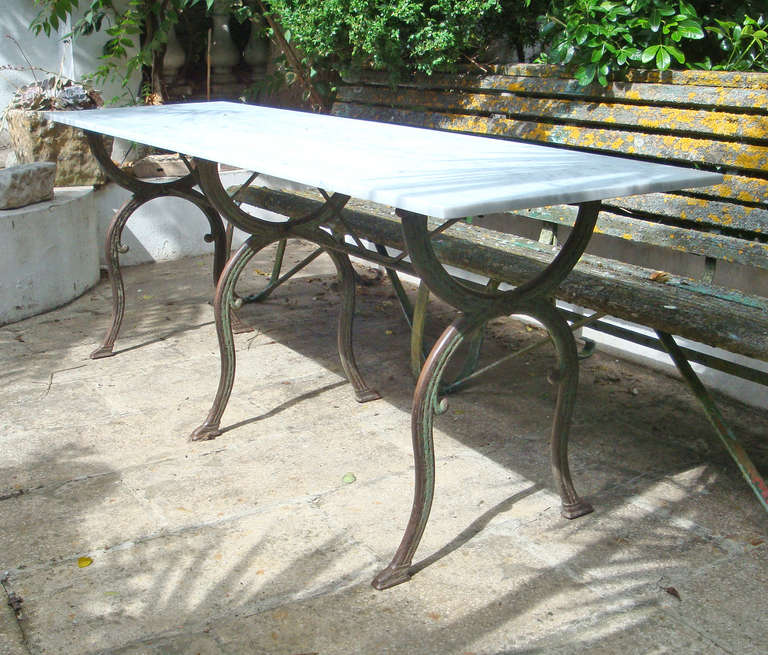 French late 19th century cast iron table with a honed marble top and original paint