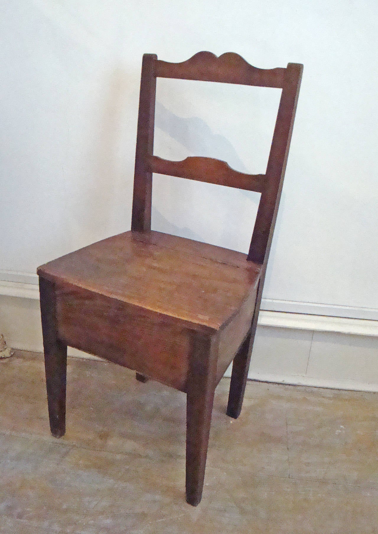 Sweet little 19th century shoe shine chair, the seat lifts up to store brushes and polish.