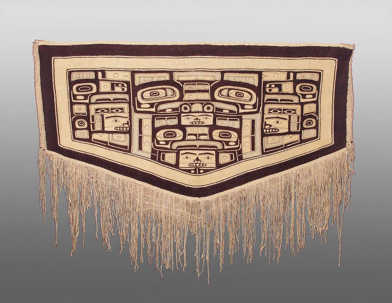 Expertly woven of mountain goat wool.  Chilkat Blankets were worn during Potlatch ceremonies by high-ranking members of the tribe.  This robe was created by a Tlingit artist from the Chilkat region in Alaska.   It was woven between 1840 and 1860 by
